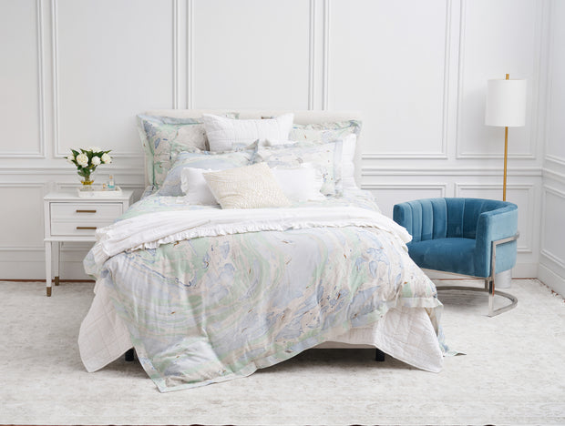 duvet cover with a marble design and decorative accessories