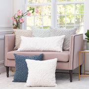 decorative pillow collection with stonewashed embroidered design on a couch