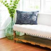 navy blue pillow with paisley design on a bench