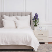 white coverlet bedding with matching pillow shams