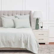 light green coverlet bedding with matching pillow shams