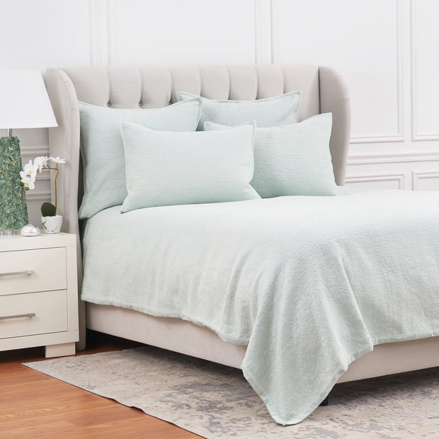 light green coverlet bedding with matching pillow shams