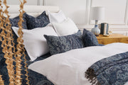 blue paisley bedding and matching pillows and shams paired with white bedding