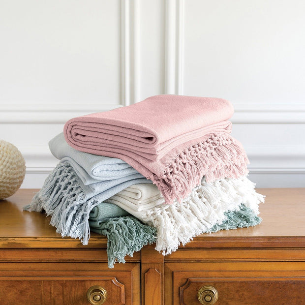 stack of lavato bed throws