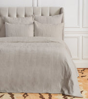 Pearl gray waffle weave coverlet.